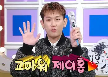Crush shows off the custom microphone gift he received from BTS's J-Hope