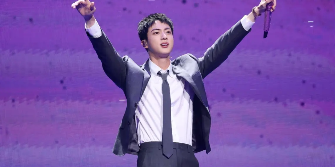 Woman who kissed BTS member Jin on the cheek during his 'hug event' last year booked for sexual harassment