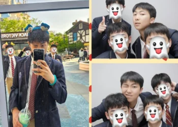 BTS's RM enjoys a day off from the military at an amusement park wearing a high school uniform